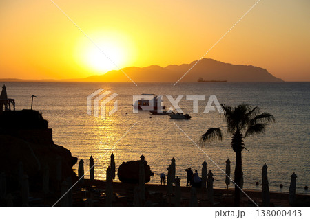 Seascape - the sun rises over the island early in the morning 138000443