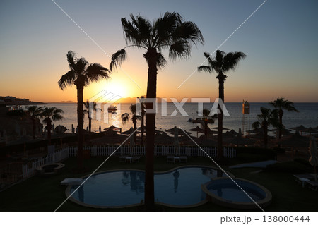 Seascape - the sun rises over the island early in the morning 138000444