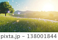 A tranquil meadow illuminated by soft sunlight and glowing particles for a dreamlike experience 138001844