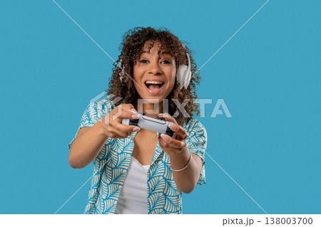 Young African Gamer Teenage Playing Online Video Game On Console With Joystick Young African Gamer Teenage Playing Online Video Game On Console With Joystick 138003700