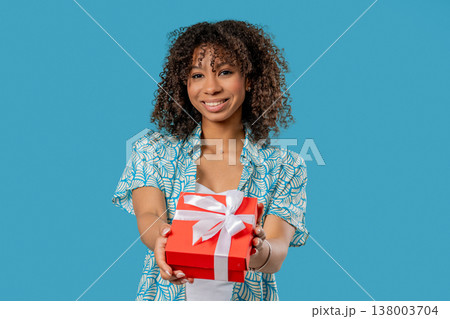 Happy Teen Girl Gift Box On Blue Background. Young Woman Smiling, Gives You 138003704