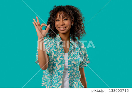 Positive African Teen Girl With Hand Sign Ok, Okay Gesture. Young lady On Blue 138003716
