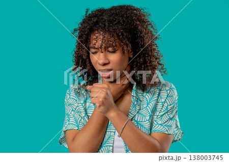 African Teenage Girl Has Sore. Woman With Swollen Throat On Blue Studio. African Teenage Girl Has Sore. Woman With Swollen Throat On Blue Studio. 138003745