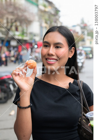 Asian Woman Holding Vietnamese Street Dessert in Hanoi Vietnam Asian Woman Holding Vietnamese Street Dessert in Hanoi Vietnam 138003797