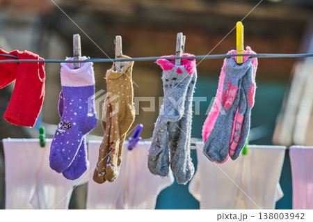 washed children's clothes are drying washed children's clothes are drying 138003942