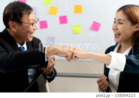 businessman and businesswoman Congratulating fit bump businessman and businesswoman Congratulating fit bump 138004223