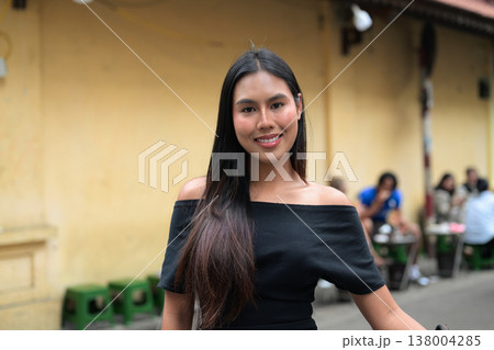 Young Thai Woman in Black Dress on Hanoi Street Young Thai Woman in Black Dress on Hanoi Street 138004285