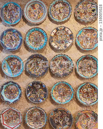 Traditional Turkish ceramic plates with intricate floral patterns on a stone wall Traditional Turkish ceramic plates with intricate floral patterns on a stone wall 138005028
