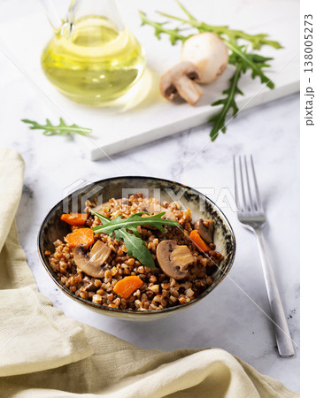 Buckwheat porridge with mushrooms, carrots and lettuce leaves, healthy nutrition Buckwheat porridge with mushrooms, carrots and lettuce leaves, healthy nutrition 138005273