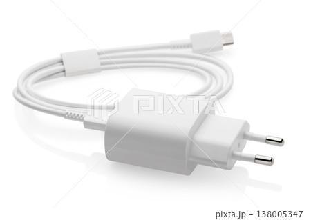 Charger block with white wire isolated on white background Charger block with white wire isolated on white background 138005347
