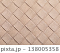 The beige texture of intertwined suede leather, forming a square abstract shape, authentic photograph, not AI-generated 138005358