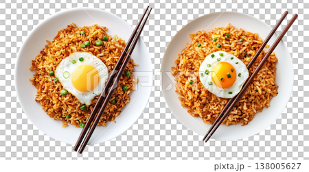 Spicy fried rice Nasi Goreng garnished with fresh green onions and topped with fried egg in bowl, isolated on white Spicy fried rice Nasi Goreng garnished with fresh green onions and topped with fried egg in bowl, isolated on white 138005627