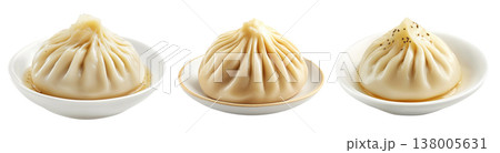 Steamed dumpling Xiao Long Bao with pleated top isolated on white background, concept of Asian traditional cuisine Steamed dumpling Xiao Long Bao with pleated top isolated on white background, concept of Asian traditional cuisine 138005631