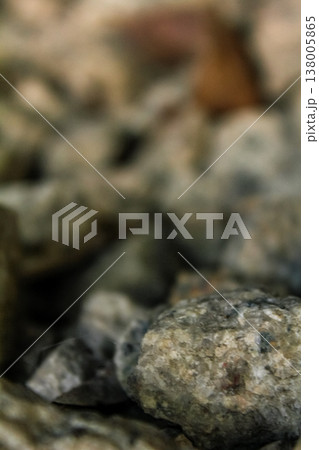 Extreme close-up view of the rocks on the old railway. Different shape of rocks on the railway. Full of rocks. Rock/stone background. Extreme close-up view of the rocks on the old railway. Different shape of rocks on the railway. Full of rocks. Rock/stone background. 138005865