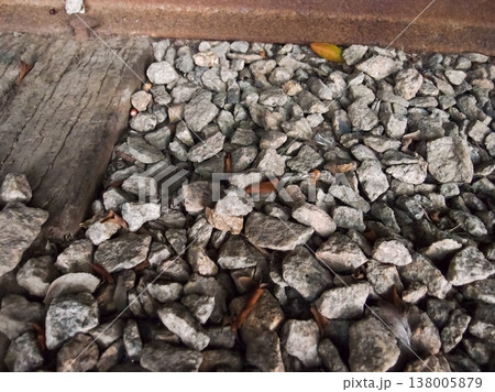 Extreme close-up view of the rocks on the old railway. Different shape of rocks on the railway. Full of rocks. Rock/stone background. Extreme close-up view of the rocks on the old railway. Different shape of rocks on the railway. Full of rocks. Rock/stone background. 138005879