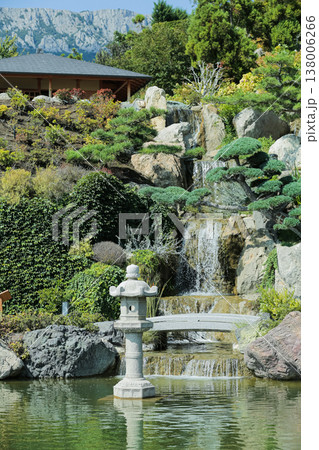 Serene Outdoor Scene. Peaceful Garden With Waterfalls. Calm Landscape Featuring Rocks And Moss Serene Outdoor Scene. Peaceful Garden With Waterfalls. Calm Landscape Featuring Rocks And Moss 138006266