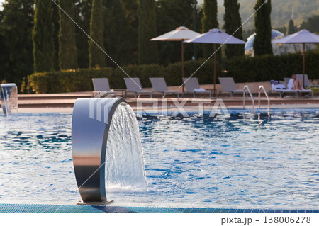 Relaxing Evening By Water. Luxury Resort Ambiance With Flowing Fountain And Peaceful Surroundings Relaxing Evening By Water. Luxury Resort Ambiance With Flowing Fountain And Peaceful Surroundings 138006278