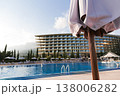 Outdoor Pool And Landscaped Surroundings. Vacation Setting With Sunlit Balcony And Lush Landscaping 138006282