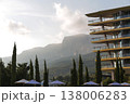 Serene Mountain Sunrise Lighting Tranquil Resort With Cypress Silhouettes And Bright Umbrellas 138006283