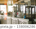 Sunlit Hotel Lounge Showcasing Ornate Hookah Bases With Staff Preparing Colorful Equipment For Guests 138006286