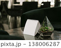 Stylish Table Setup With Calming Ambiance. Relaxing Lounge Scene With Inviting Light And Decor 138006287