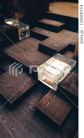 Wooden cube blocks forming stairs pattern with light and texture abstract background, Geometric wood surface lluminated, modern design composition backdrop Wooden cube blocks forming stairs pattern with light and texture abstract background, Geometric wood surface lluminated, modern design composition backdrop 138006554