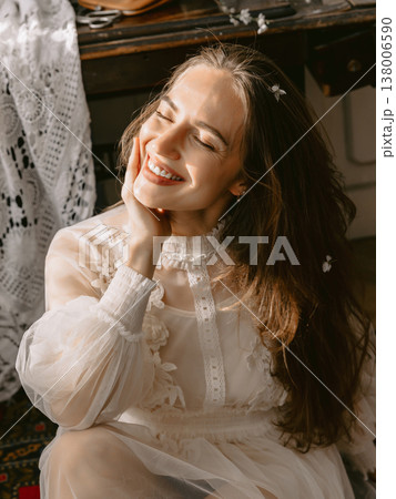Dreamy portrait of young woman in lace dress, soft smile and romantic vintage mood. Dreamy portrait of young woman in lace dress, soft smile and romantic vintage mood. 138006590