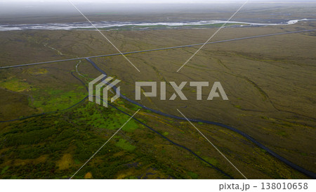 Aerial View of Icelandic Landscape with Straight Road and River 138010658