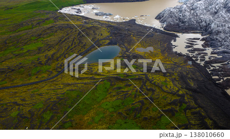 Aerial View of Icelandic Glacier, Lagoon, and Volcanic Terrain 138010660