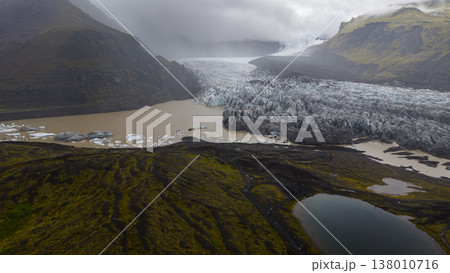 Aerial View of Icelandic Glacier and Glacial Lagoon with Volcanic Terrain 138010716
