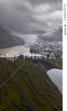 Aerial View of Icelandic Glacier and Glacial Lagoon with Volcanic Terrain 138010717