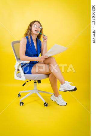 Young woman thinking deeply, holding pencil, looking for ideas Young woman thinking deeply, holding pencil, looking for ideas 138010880
