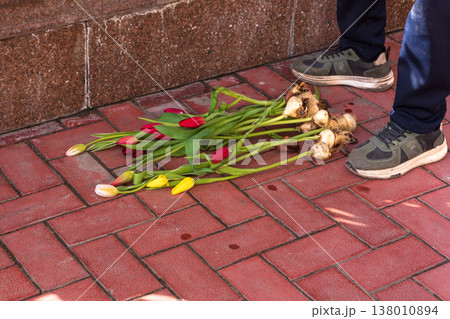 Rejected gift of spring flowers, end of romance and emotional heartbreak concept. Rejected gift of spring flowers, end of romance and emotional heartbreak concept. 138010894