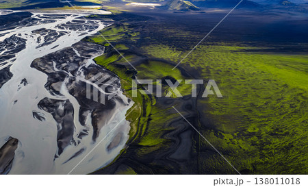 Aerial View of Braided River and Moss Covered Volcanic Terrain in Iceland 138011018