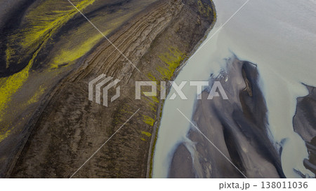 Aerial View of Volcanic Terrain and Glacial River in Iceland 138011036