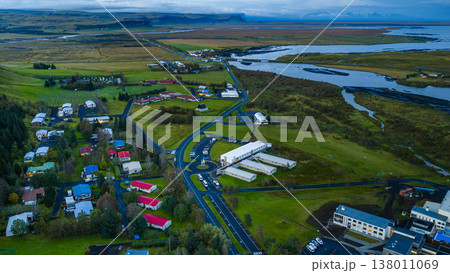Aerial View of Icelandic Town with Green Fields and Winding Roads Aerial View of Icelandic Town with Green Fields and Winding Roads 138011069