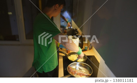 Serene domestic setting with individual preparing morning meal happily Serene domestic setting with individual preparing morning meal happily 138011181