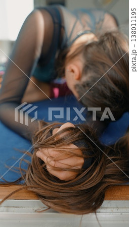 Gentle repose with soft sunlight illuminating relaxed long hair Gentle repose with soft sunlight illuminating relaxed long hair 138011195