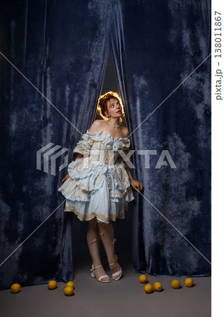 Vintage Woman Peering. Woman Peeks From Backstage Area. Curious Woman Steps Into Faint Illumination Vintage Woman Peering. Woman Peeks From Backstage Area. Curious Woman Steps Into Faint Illumination 138011867