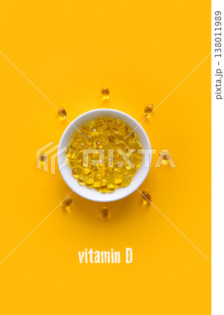 Soft gels vitamin D (cholecalciferol)  capsules in white bowl 138011989