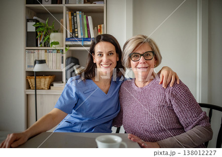 Portrait of physiotherapist and senior woman during rehabilitation exercise. 138012227
