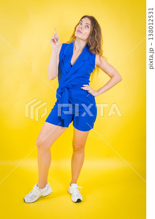 Woman pointing up showing idea or direction Woman pointing up showing idea or direction 138012531
