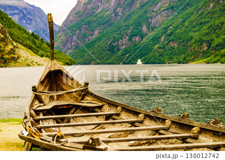 Old viking boat and ferryboat on fjord, Norway 138012742
