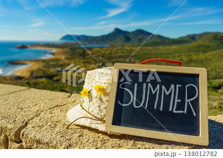 Black board with word summer against sea coast Black board with word summer against sea coast 138012782