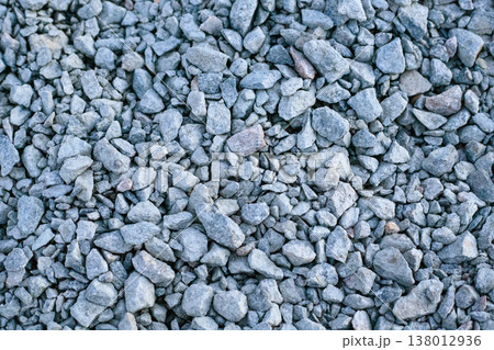 Crushed grey stone texture with various sizes of sharp-edged granite rocks. 138012936