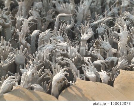 Sculptures of reaching hands from hell at Wat Rong Khun White Temple in Chiang Rai Sculptures of reaching hands from hell at Wat Rong Khun White Temple in Chiang Rai 138013078