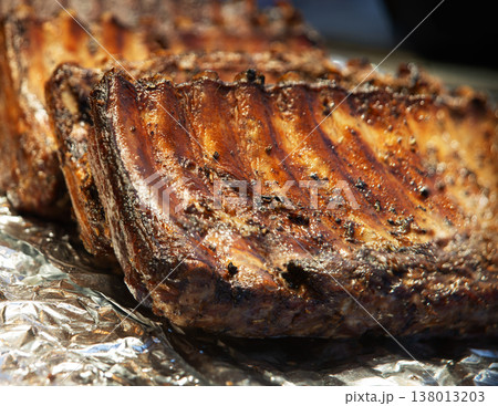 Fried ribs lie on foil Fried ribs lie on foil 138013203