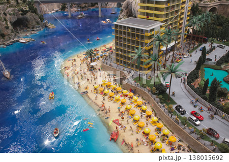Aerial view of a miniature luxury beach resort with vibrant seaside life Aerial view of a miniature luxury beach resort with vibrant seaside life 138015692