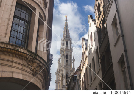 View of the gothic tower of the Brussels Town Hall from a narrow street 138015694