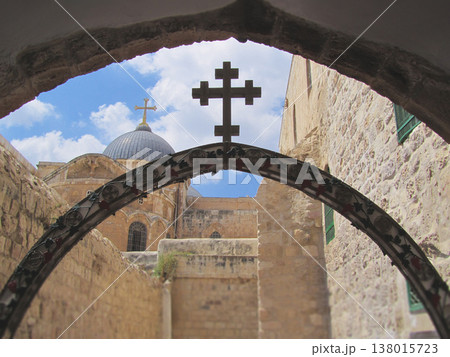 View of the Church of the Holy Sepulchre through an ornate arch in Jerusalem View of the Church of the Holy Sepulchre through an ornate arch in Jerusalem 138015723